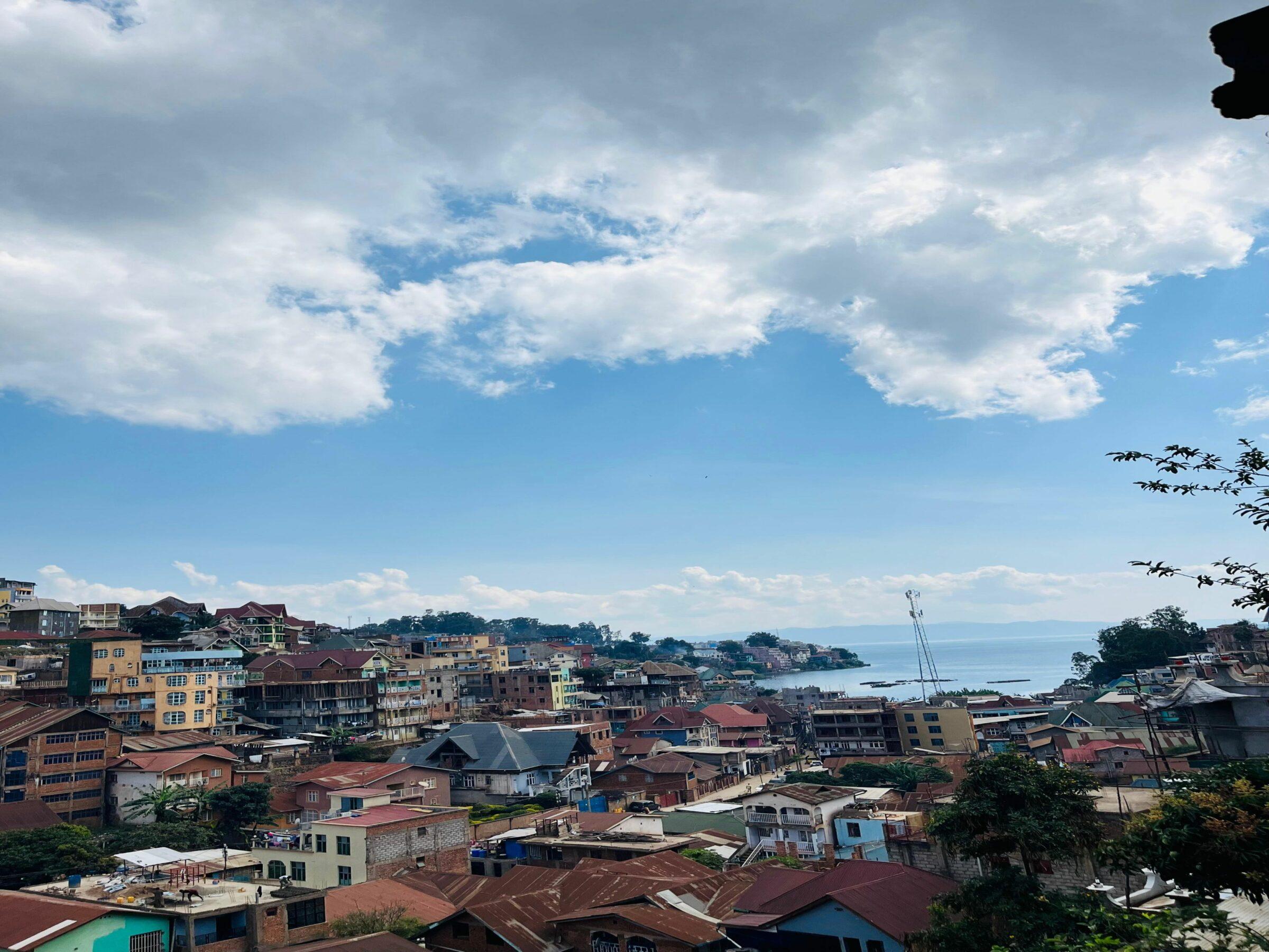 View of seaside buildings in Bukavu, DRC, on a clear day.